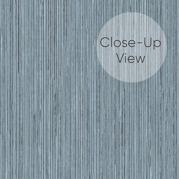 Serene dusty blue wallpaper with a continuous vertical grain, perfect for Japandi-inspired home decor settings.