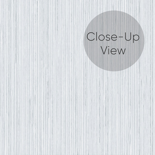 A detailed view of the Light Blue Vertical Texture Wallpaper revealing its hand-drawn pinstripes and fabric-like grain. This matte, traditional unpasted wallpaper is perfect for creating a serene atmosphere in minimalist bedrooms or bright home offices, emphasizing eco-friendly materials and easy application.