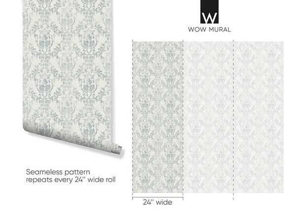 A close-up of Light Blue Rococo wallpaper with ornate motifs on a warm ivory ground. The fabric-like finish adds elegance to any room, making it ideal for vintage and French country decor. Easy to apply and reposition.