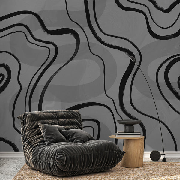 Neutral black and gray wallpaper with sweeping organic lines over a subtle textured background for modern and minimalist home decor.