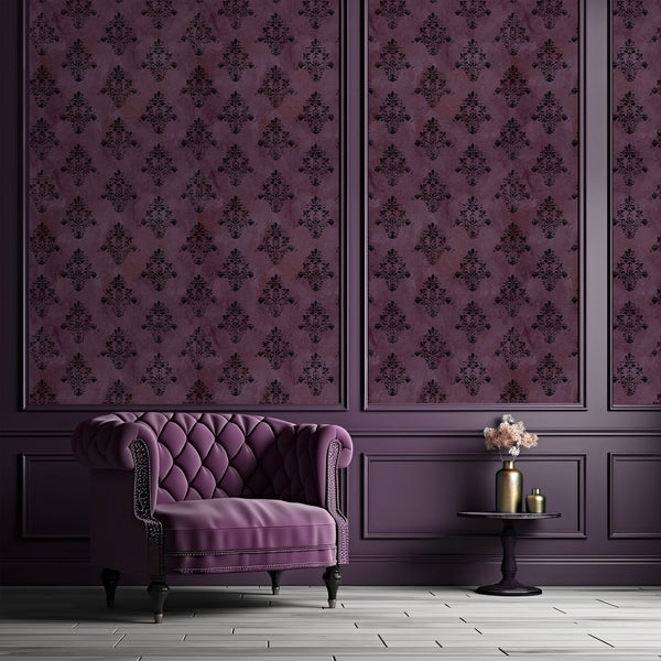 Dark purple damask wallpaper with distressed black floral ornaments and an aged textured background, ideal for gothic bedrooms and moody interiors.