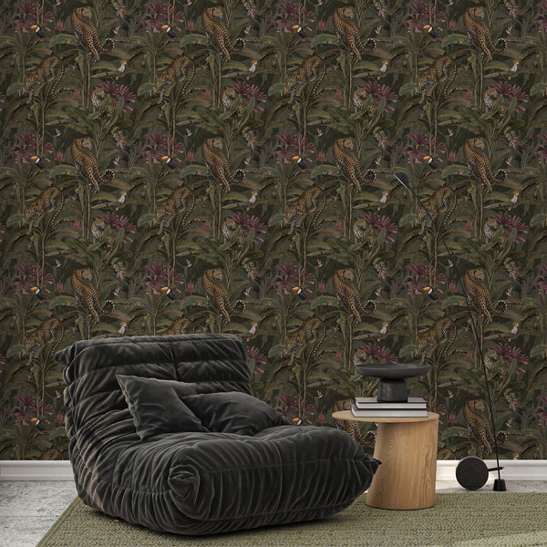 Moody tropical peel and stick wallpaper featuring leopards climbing among banana leaves, orange-beaked toucans and white cockatoos for bedroom decor.