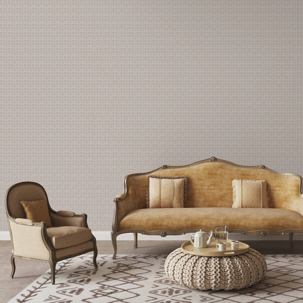 Small-scale floral damask wallpaper in muted dusty pink and soft white with an aged texture, ideal for French country bedroom and cottagecore interiors.