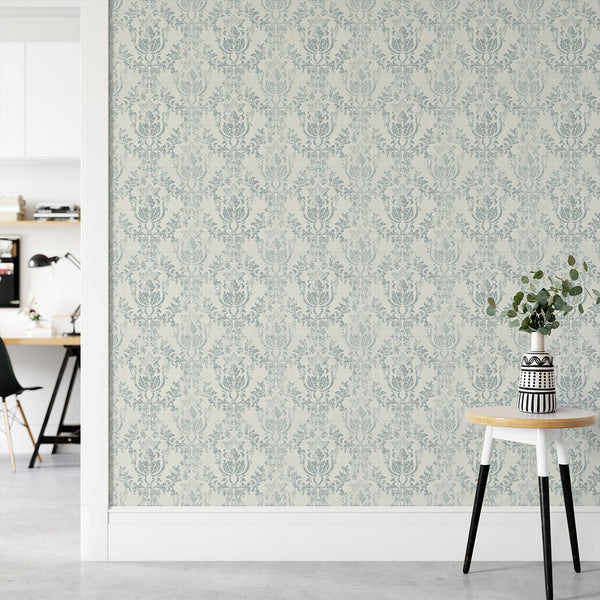 Scrolling foliage and rococo motifs in muted blue characterize the Light Blue Rococo wallpaper. Perfect for a traditional living room accent wall, this pre-pasted wallpaper ensures easy application and is made from eco-friendly materials.