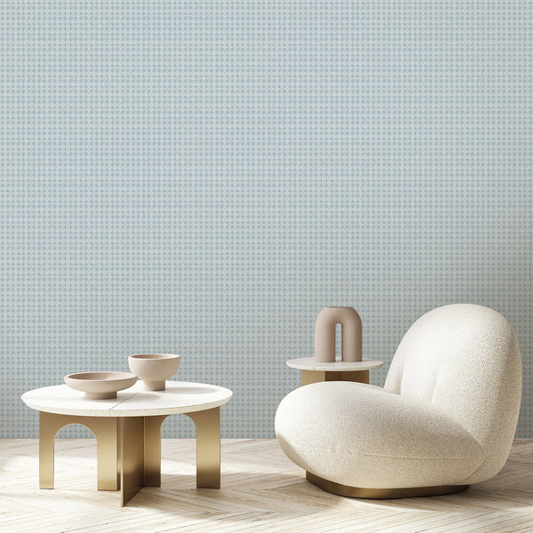 Vintage blue damask wallpaper featuring small repeating floral ornaments on a pale blue background with subtle distressed texture for elegant interiors.