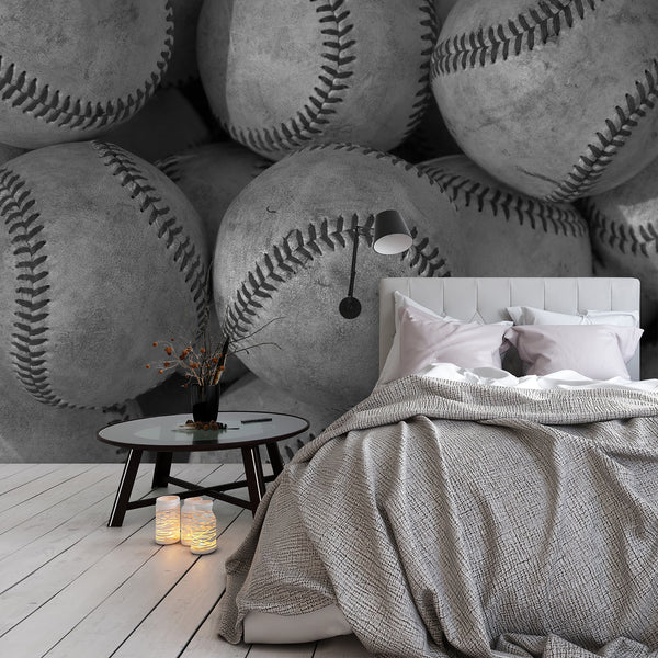 Vintage baseball wallpaper in black, white and gray tones with textured worn baseballs, perfect for a boys bedroom, teen room or sports space.