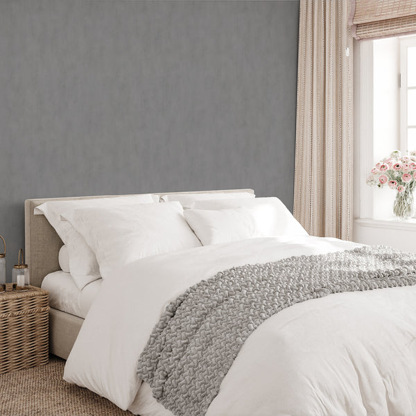Gray Plaster Look Wallpaper with a smooth, uniform finish and gentle cloudy variations. Perfect for creating a contemporary, neutral setting in living rooms or hallways, this eco-friendly, removable wallpaper emphasizes easy application and high-quality design.