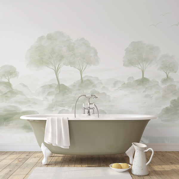 Neutral watercolor wall mural with pale sage green trees, soft meadow details and misty scenery for a modern nature inspired bedroom or living room.