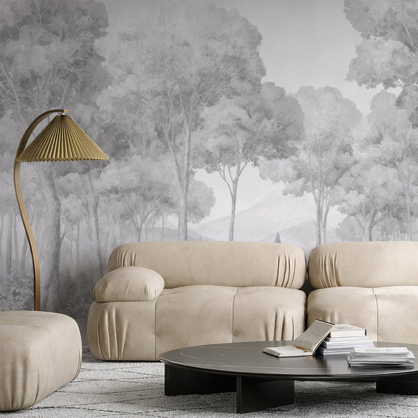 Subtle watercolor grain in a gray misty forest mural, providing a tranquil atmosphere for a living room accent wall. This temporary wallpaper is made in the USA and offers easy application and repositioning.
