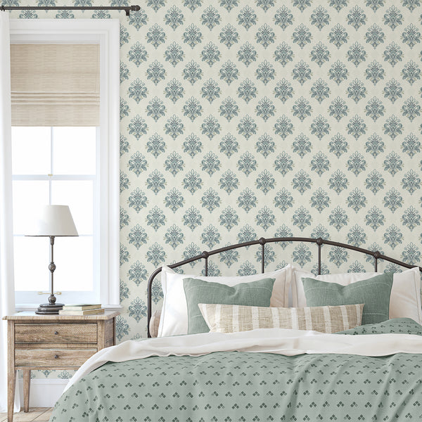 Vintage floral damask wallpaper with muted blue gray botanical scrollwork, delicate ornamental details and a subtle cream background for classic interiors.