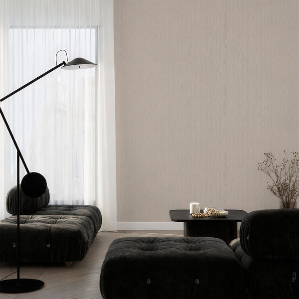 Vertical texture wallpaper in soft beige with a textile-like appearance, creating a calm yet structured aesthetic in home offices. The easy-to-reposition material ensures it's a perfect choice for designers seeking modern wallpaper solutions.