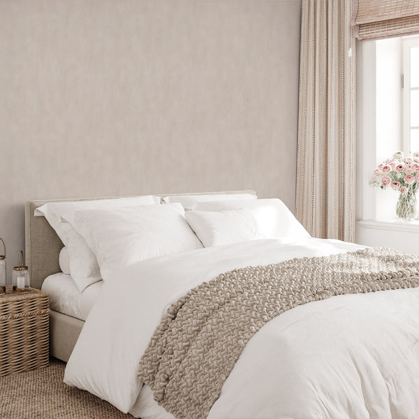 Soft beige plaster look wallpaper with a calm matte finish, ideal for living rooms. The subtle, cloud-like tonality provides a neutral foundation for Japandi and Scandinavian interiors, enhancing the serene atmosphere.