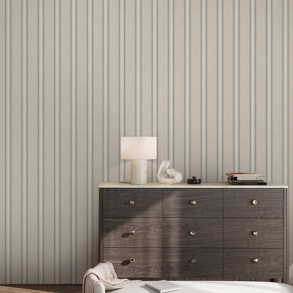 French country ticking stripe wallpaper in soft beige and muted blue with delicate repeating vertical lines, perfect for elegant cottage and rustic interiors.