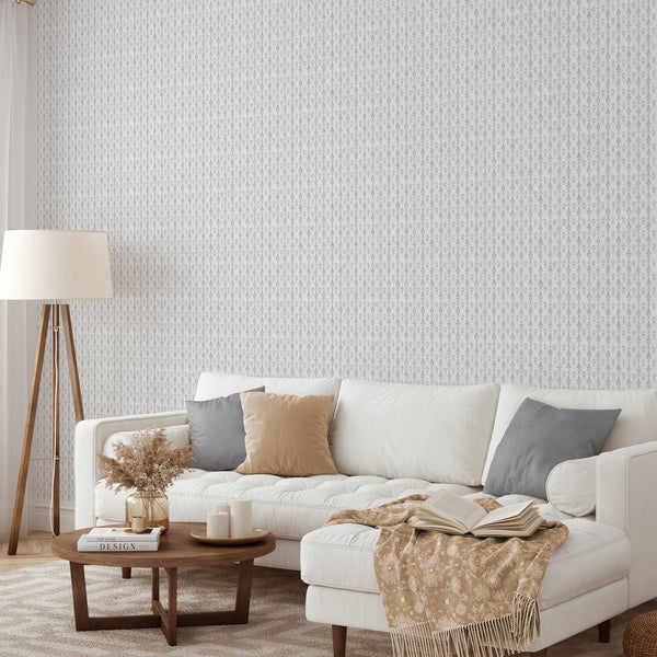 Gray damask wallpaper with narrow vertical emblems, perfect for elevating French country or cottage interiors. The self-adhesive wallpaper's cool gray pattern on a pale off-white ground adds a touch of elegance to bedrooms or dining rooms.