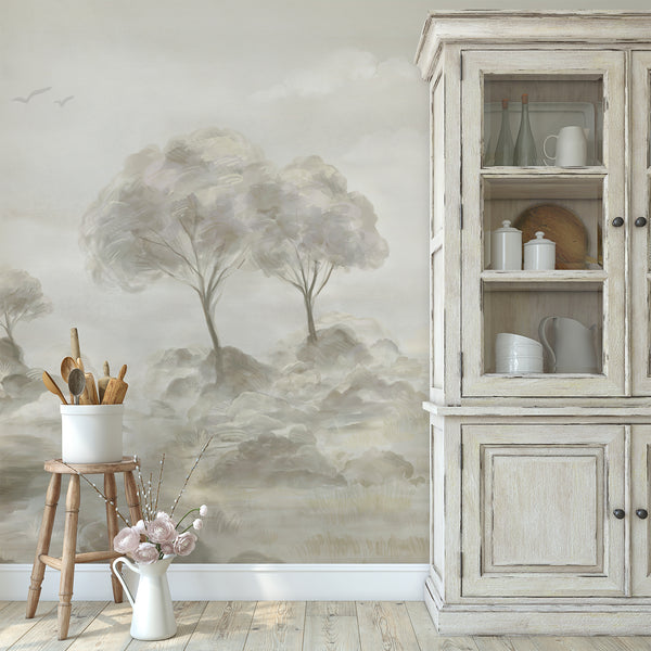 Neutral tree wallpaper with soft watercolor brushwork, hazy landscape details and warm natural beige shades for a serene bedroom or living room wall.