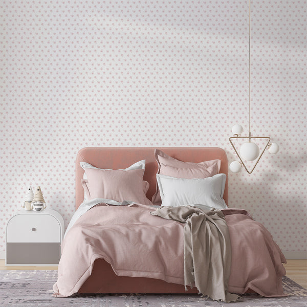 Minimalist pink flower wallpaper featuring delicate hand sketched floral motifs on a white background for girls room, nursery and bedroom decor.