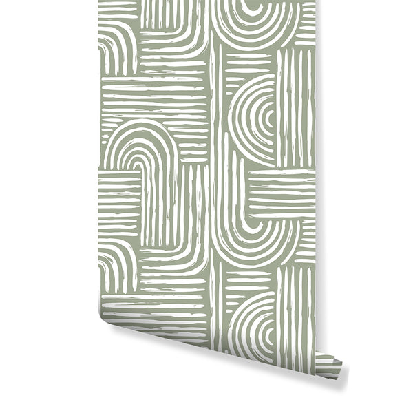 Green Boho Wallpaper featuring painterly geometric design with oversized U-shaped arcs and stacked blocks filled with hand-drawn white brush lines on a muted sage green ground. Perfect for a modern boho living room or bedroom, this removable peel and stick wallpaper offers a bold accent wall option with its broad arcs and long stripe bands.