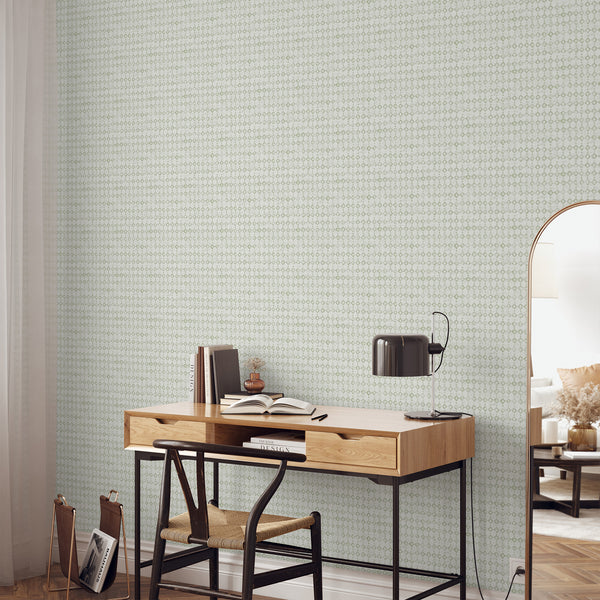 Sage green geometric wallpaper with a tiny diamond lattice adds an airy grid to home offices and hallways. The eco-friendly removable material is easy to apply, making it a versatile choice for those seeking a modern minimalist aesthetic.