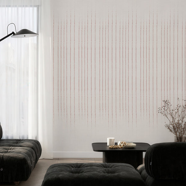 Dusty pink vertical stripes wall mural with hand-painted lines in dusty rose against a light linen-like background, perfect for adding a Scandinavian touch to bedrooms or living rooms.