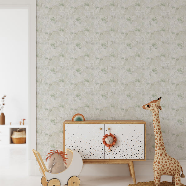 Watercolor woodland wallpaper with overlapping pale green and gray trees, delicate branches and abstract dotted foliage in a Scandinavian nature-inspired design.