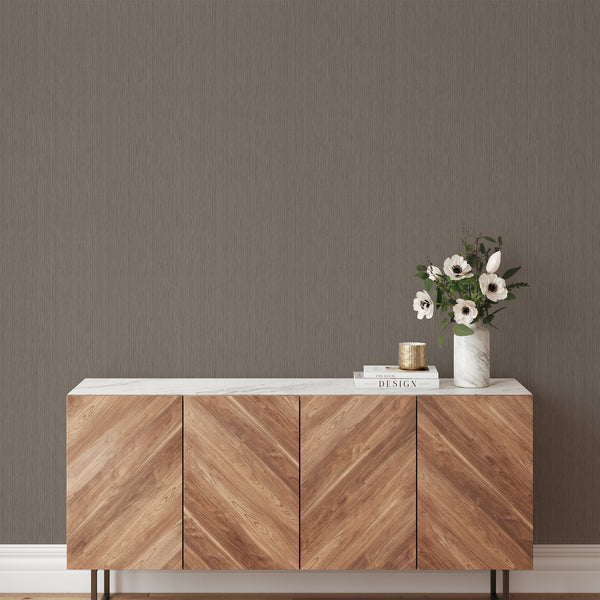 Taupe Vertical Texture Wallpaper with two-tone shifts creating a woven grasscloth look, perfect for accent walls in modern interiors. This eco-friendly, removable wallpaper is tailored for decorators aiming to bring subtle vertical emphasis to their designs.