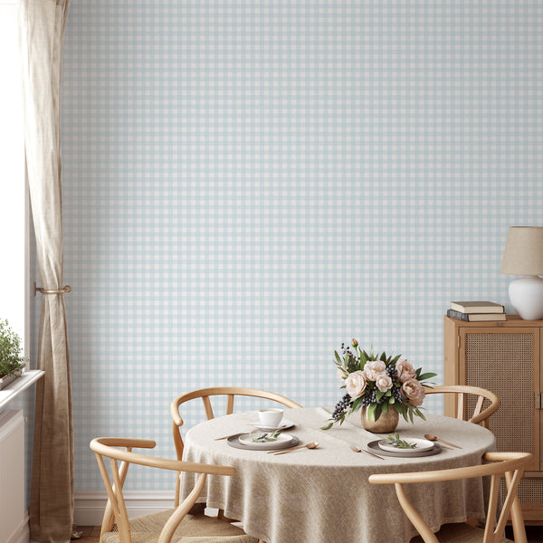 Pale blue checkered wallpaper with layered plaid lines and airy white squares, perfect for a nursery, bedroom, or cottage-style room.