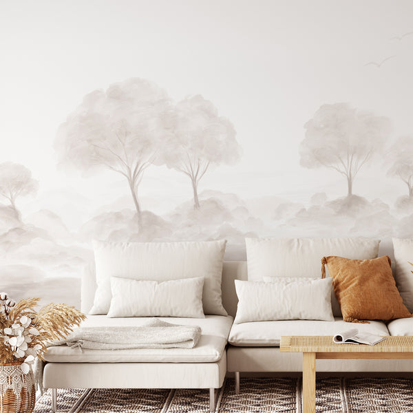 Watercolor forest wallpaper with pale trees, soft shrubs and an airy neutral palette, ideal for a modern living room, bedroom or home office wall.