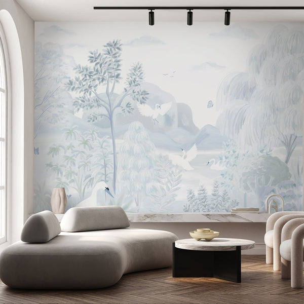 Soft light blue wallpaper with white swans, pastel trees and distant mountains in an elegant landscape scene.