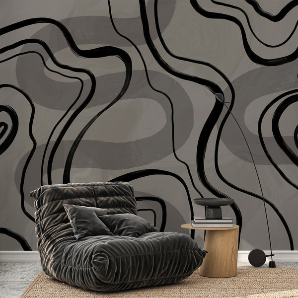 Neutral abstract wallpaper with dramatic black curved lines layered over soft gray shapes, designed for modern living room or bedroom decor.