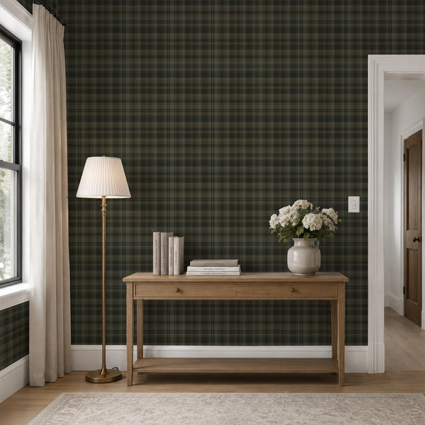 Moody tartan wallpaper with overlapping dark green and brown checkered stripes, creating a rustic vintage plaid design with subtle woven-style detailing.