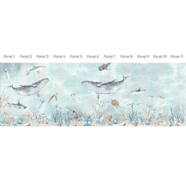 Ocean-themed Sea World Wall Mural featuring watercolor whales, sharks, and sea turtles in soft seafoam and muted blues. Ideal for nurseries or kids' rooms, this removable, eco-friendly wallpaper offers a soothing underwater panorama with coral clusters and jellyfish. Made in the USA, it suits hallways or feature walls, perfect for renters and decorators seeking temporary yet high-quality decor.