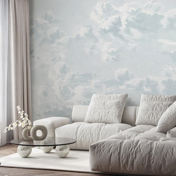 Light blue cloud wall mural featuring soft dreamy clouds and neutral sky tones, creating an airy backdrop for a peaceful bedroom or nursery.