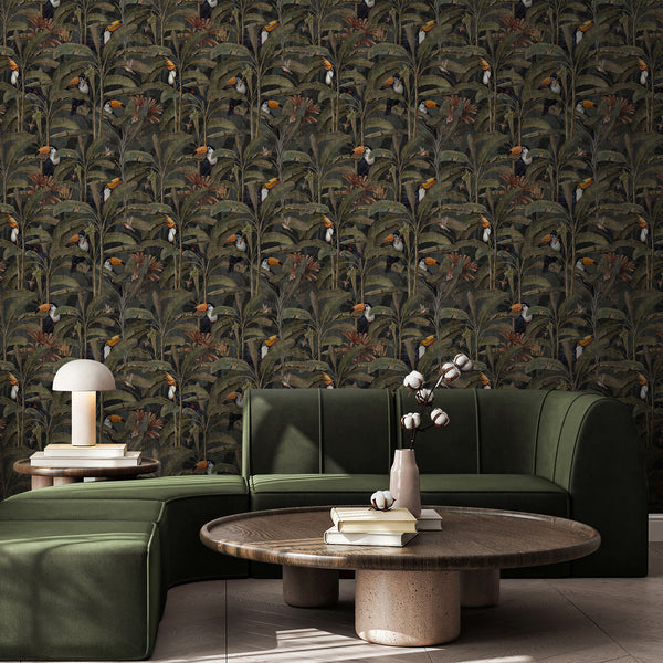 Moody jungle wallpaper with exotic toucans, small hummingbirds and layered tropical plants in muted green, brown and rust tones for living room decor.