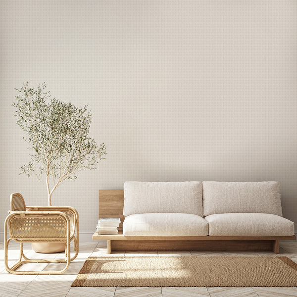 Neutral beige wallpaper featuring faded damask floral motifs on a warm off white background, perfect for French country and vintage inspired interiors.