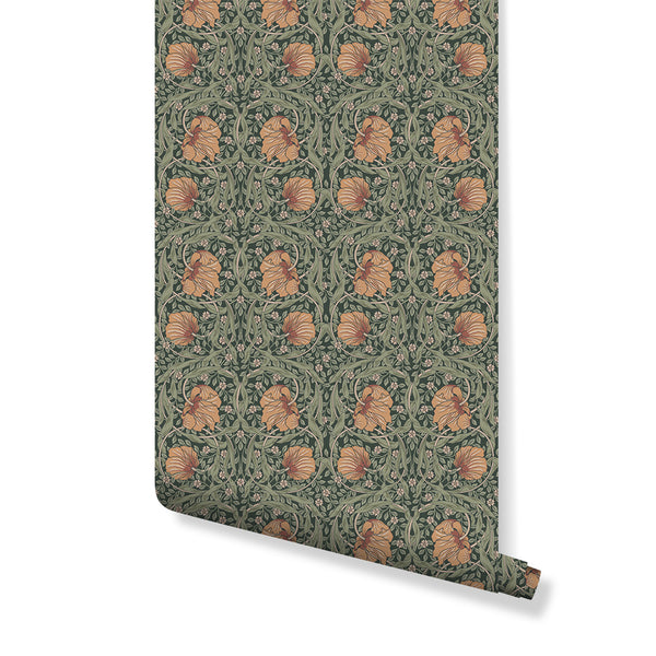 Pimpernel by Morris wallpaper with stylized poppy blooms and foliate bands in peach and sage on a green ground. This vintage floral wallpaper is ideal for creating a warm, traditional feel in dining rooms or studies.