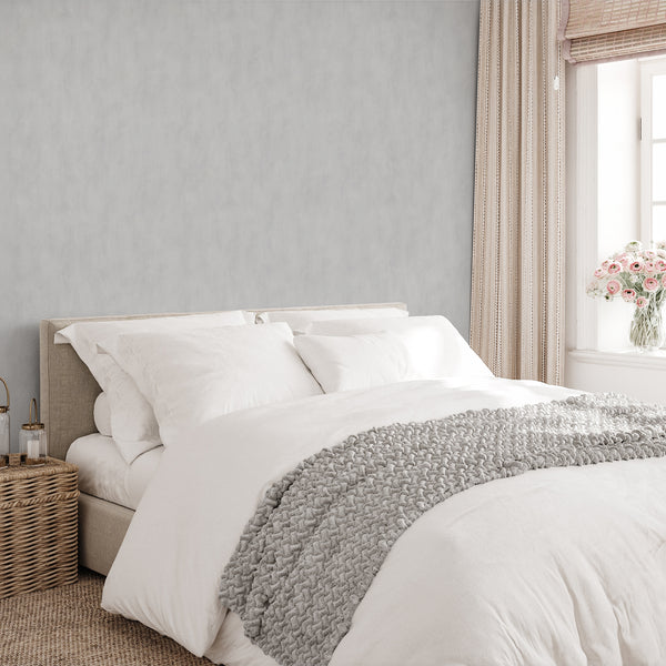 Smooth plaster look wallpaper with a velvety grain, enhancing the minimalist aesthetic of any room.
