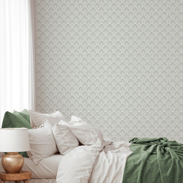 Dense fan leaf wallpaper in muted sage green, offering a small-scale pattern on a neutral ground with a linen texture. The vertical rhythm adds calm movement, making it ideal for home offices or bedrooms. This high-quality removable wallpaper is easy to apply and reposition, offering a versatile and temporary design solution.