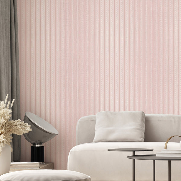 Dusty rose striped wallpaper featuring delicate white flowers, slender botanical stems, and playful wavy lines for French country inspired interiors.