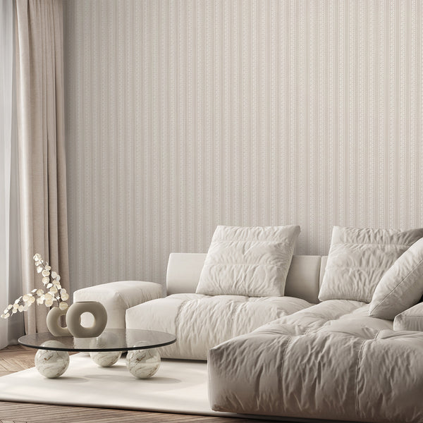 Beige floral stripe wallpaper featuring delicate white botanical sketches, scalloped wave borders, and a subtle textured background for neutral interiors.