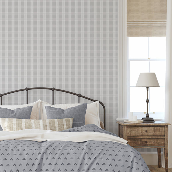 Soft gray plaid wallpaper with pale white checks and delicate woven-style lines, ideal for a modern bedroom accent wall or living room wallpaper.