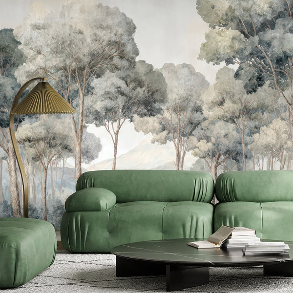 Panoramic misty forest wall mural with muted greens and soft gray mist, creating a soothing atmosphere in a living room. This removable wall mural is eco-friendly and perfect for modern home decor.