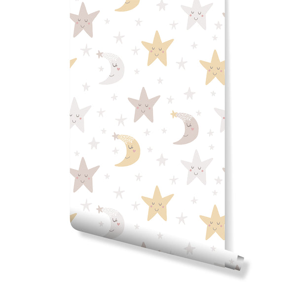Airy Moon Stars Wallpaper with doodle-like crescent moons and five-point stars in soft butter yellow and faint blush on a bright white background. Ideal for gender-neutral nursery decor, this removable wall mural adds a calm, modern touch to children's rooms. The pattern's open scale and playful rotation create a serene atmosphere.