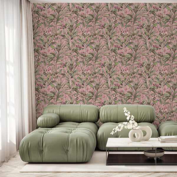 Vintage parrot wallpaper with green tropical birds, dusty pink flowers, banana leaves and layered botanical foliage on a textured pink background.