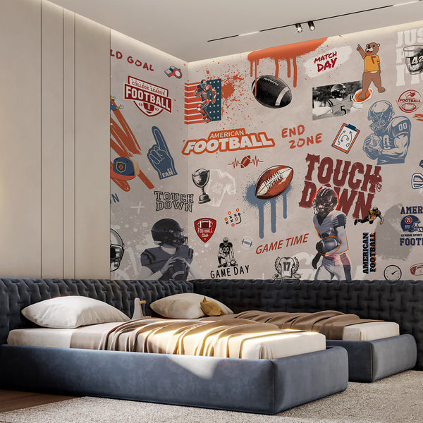 American Football Graffiti Wall Mural with urban street-art energy, featuring illustrated players, helmets, and bold slogans, ideal for a modern playroom or game room. The design combines rust orange, navy blue, and black tones with spray-paint textures, adding dynamic movement and style to interior decor.