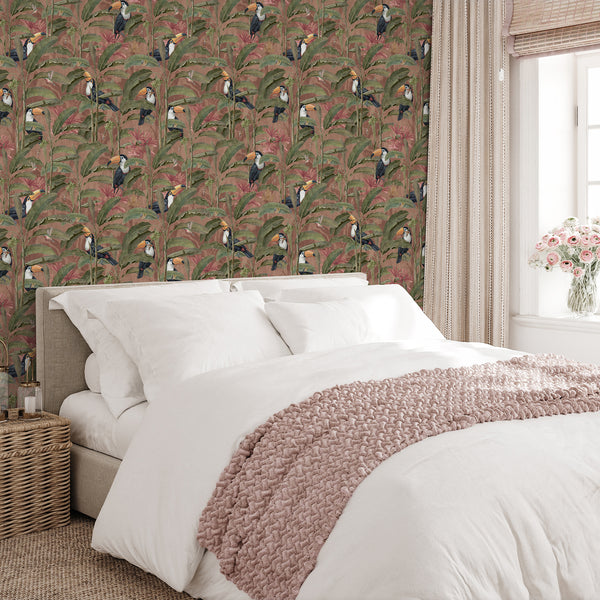 Tropical rainforest wall mural featuring black and white toucans, delicate hummingbirds and layered banana leaves on a muted pink jungle background.
