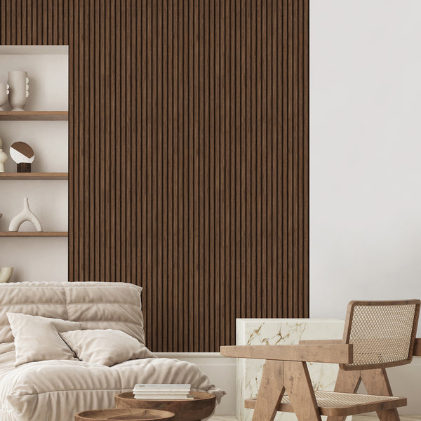 Close-up of Wooden Walnut Slat Panels wallpaper featuring mid-to-dark walnut hues and fine grain texture. The vertical slat design is perfect for creating an accent wall in a bedroom or home office. This temporary, self-adhesive wallpaper is high-quality and made in the USA, suitable for interior design enthusiasts seeking a modern rustic look.