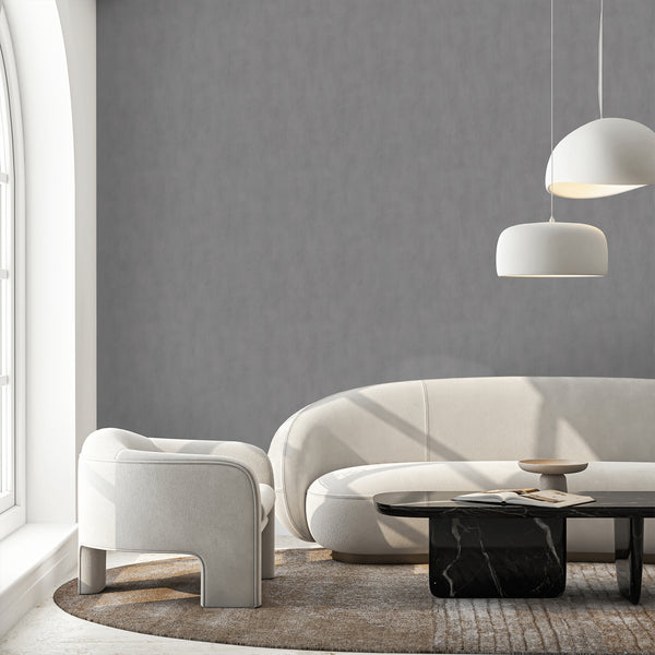 Close-up of Gray Plaster Look Wallpaper showcasing its subtle broad mottling and matte mid-to-dark gray tones. Perfect for creating depth in hallways or home offices, this traditional unpasted wallpaper emphasizes eco-friendly benefits and high-quality removable options.