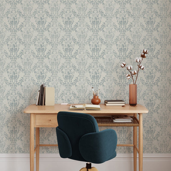 The Light Blue Rococo wallpaper adds timeless elegance with its ornate motifs and weathered finish. Perfect for a traditional bedroom, this eco-friendly, removable wallpaper is made in the USA, ensuring quality and style.
