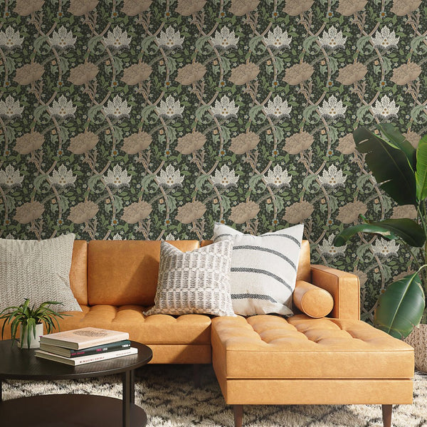 Green & Beige Windrush by Morris offers a botanical lattice of flowerheads and stems on a deep green ground. The beige and sage tones, along with tiny blue accents, provide a stunning statement for living rooms or studies desiring a traditional yet modern floral backdrop.