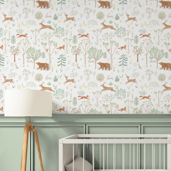 This removable peel and stick wallpaper features woodland animals in muted tones, ideal for renters seeking a playful nursery accent wall.